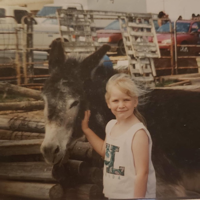 young Bree with donkey